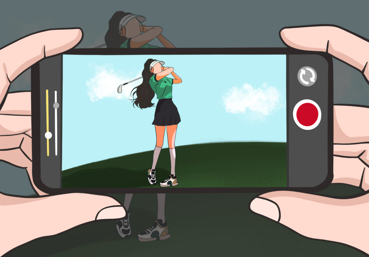 A Gollini takes the shot from the rough, her follow-through firm as she freezes for the camera. She seems more concerned about the photo op than the fairway. 